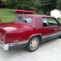 1991 Burgundy Cadillac DeVille thumbnail