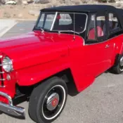 1950 Red Willys Overland Jeepster thumbnail