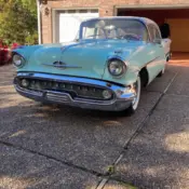 1957 White Oldsmobile Golden Rocket thumbnail