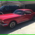 1964 Red Ford Mustang thumbnail