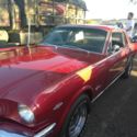 1965 Burgundy Ford Mustang thumbnail