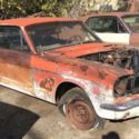 1965 red Ford Mustang thumbnail