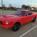 1965 red Ford Mustang thumbnail