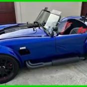 1965 Red Shelby Cobra thumbnail