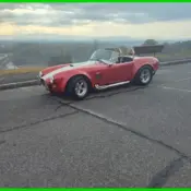 1965 Red Shelby Cobra thumbnail