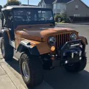 1973 Orange Jeep CJ thumbnail