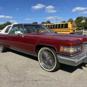 1976 Red Cadillac De Ville thumbnail