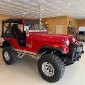 1976 Red Jeep CJ thumbnail