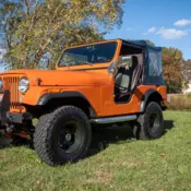 1976 Orange Jeep CJ thumbnail
