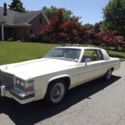 1984 Yellow Cadillac DeVille thumbnail