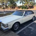 1984 Yellow Cadillac Seville thumbnail