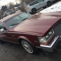 1985 Burgundy Cadillac Seville thumbnail