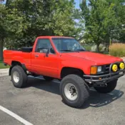 1985 Orange Toyota Pickup thumbnail