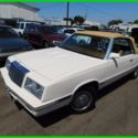 1985 Tan Chrysler LeBaron thumbnail