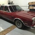 1986 Red Chrysler New Yorker thumbnail