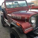 1986 Burgundy Jeep CJ thumbnail