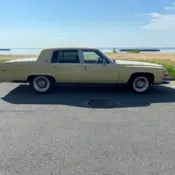 1987 Yellow/beige Cadillac Brougham thumbnail
