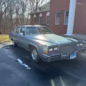 1987 Blue Cadillac Brougham thumbnail