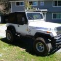 1987 Blue Jeep Wrangler thumbnail