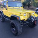 1987 Yellow Jeep Wrangler thumbnail