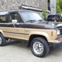 1988 brown/gold Ford Bronco II thumbnail