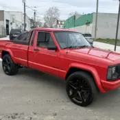 1988 Red Jeep Comanche thumbnail