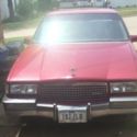 1990 Burgundy Cadillac DeVille thumbnail