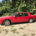 1990 Red Mercury Cougar thumbnail