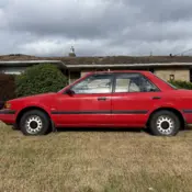 1990 Red Mazda Protege thumbnail