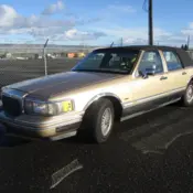 1991 Gold Lincoln Town Car thumbnail