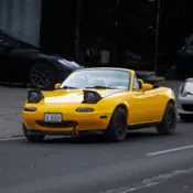 1991 Yellow Mazda MX-5 Miata thumbnail