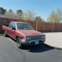 1991 Burgundy Toyota Pickup thumbnail