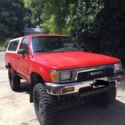 1991 Red Toyota pickup thumbnail