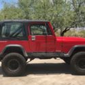 1991 Red Jeep Wrangler thumbnail