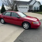 1992 Red Ford Taurus thumbnail