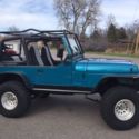 1994 Teal Jeep Wrangler thumbnail