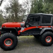 1994 Orange & Black Jeep Wrangler thumbnail