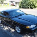 1994 black Ford Mustang thumbnail