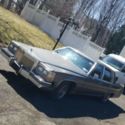 1985 Gray Cadillac Fleetwood brougham thumbnail
