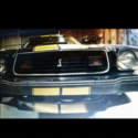 1977 Black and gold Ford Mustang thumbnail