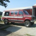 1989 Burgundy Ford E-Series Van thumbnail