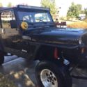 1990 Black Jeep Wrangler thumbnail