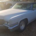 1970 grey primer Cadillac DeVille thumbnail