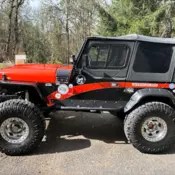 1994 Orange & Black Jeep Wrangler thumbnail