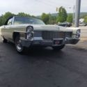 1965 Yellow Cadillac DeVille thumbnail