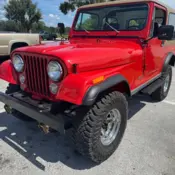 1977 Red Jeep CJ thumbnail