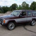 1987 Maroon/Silver Jeep Wagoneer thumbnail