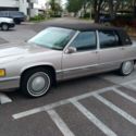 1993 Silver, grey, with a black top Cadillac DeVille thumbnail