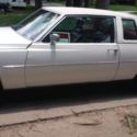 1977 White Cadillac Deville thumbnail