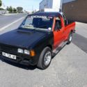 1980 Red Datsun Pickup thumbnail